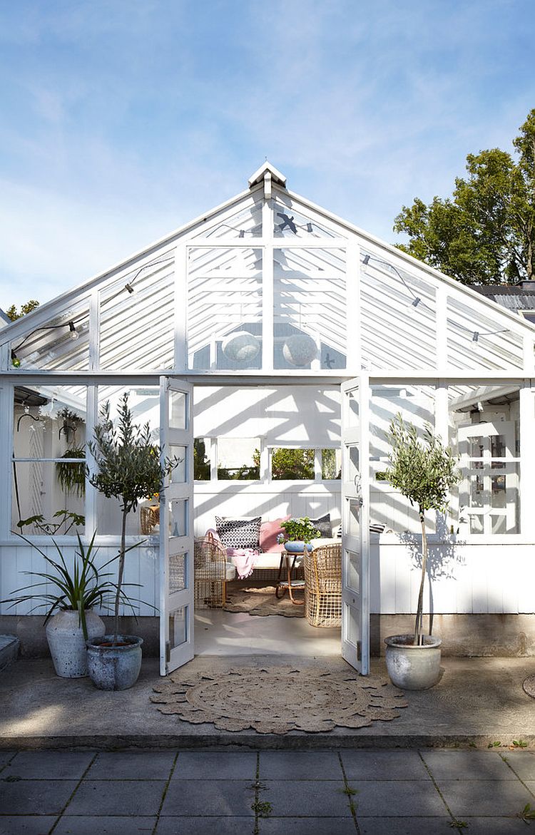 Elegant Scandinavian sunroom with a hint of farmhouse panache