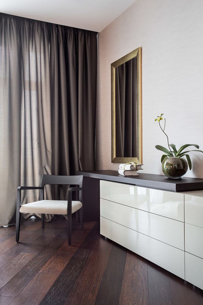 Elegant bedroom corner with draperies and an orchid