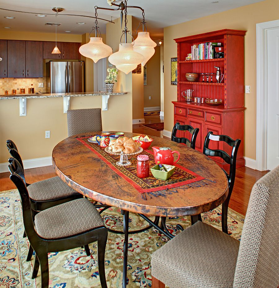 Fabulous dining room hutch adds red to the eclectic setting [Design: Tracey Stephens Interior Design]