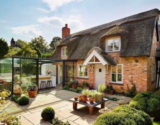 Dreamy 18th-Century English Cottage Acquires an Inspired Glass Box Kitchen