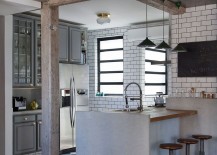 Gray-cabinets-and-tiles-separate-the-kitchen-from-the-small-living-space-217x155