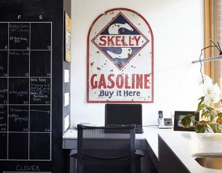 Home office with corner workspace and chalkboard wall