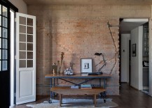 Home-workspace-with-table-on-wheels-and-exposed-brick-wall-217x155