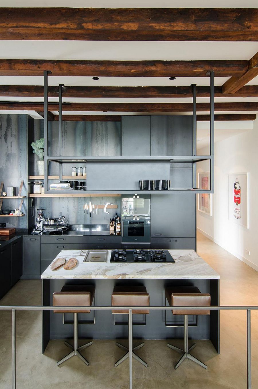 Industrial modern kitchen with exposed wooden beams and gray cabinets