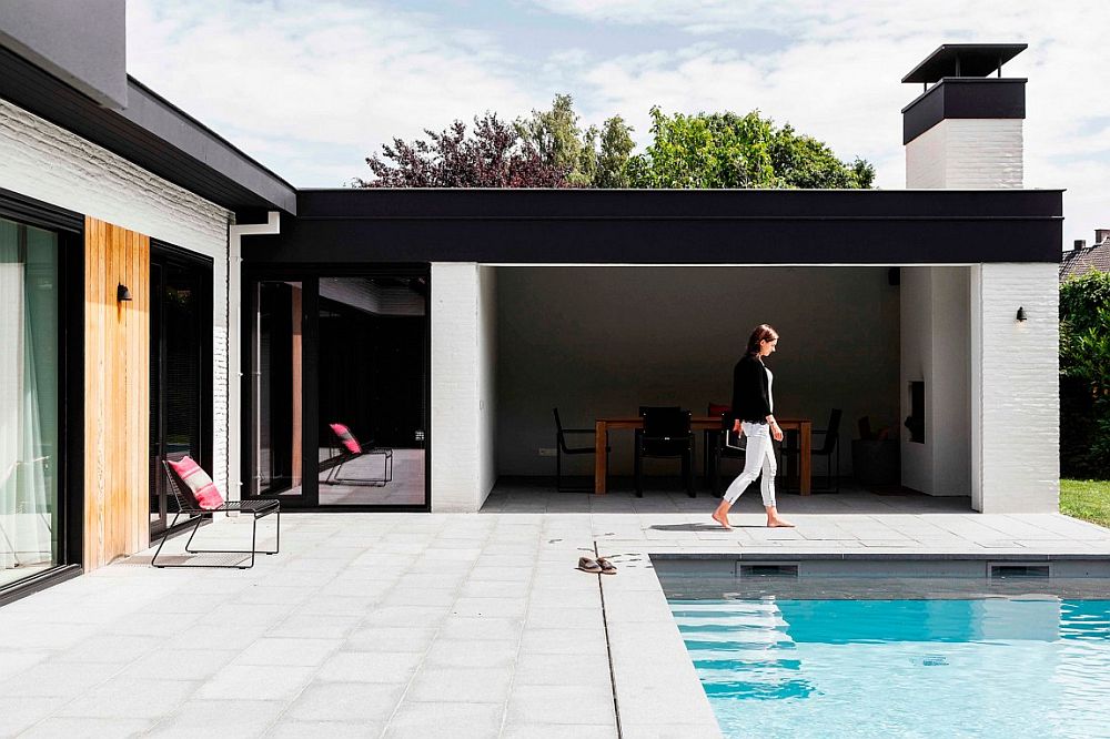 L-shaped structure of the home warps itself around the lovely pool