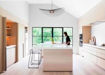 Large-Vertigo-lamp-shines-above-the-smart-modern-kitchen-island-217x155