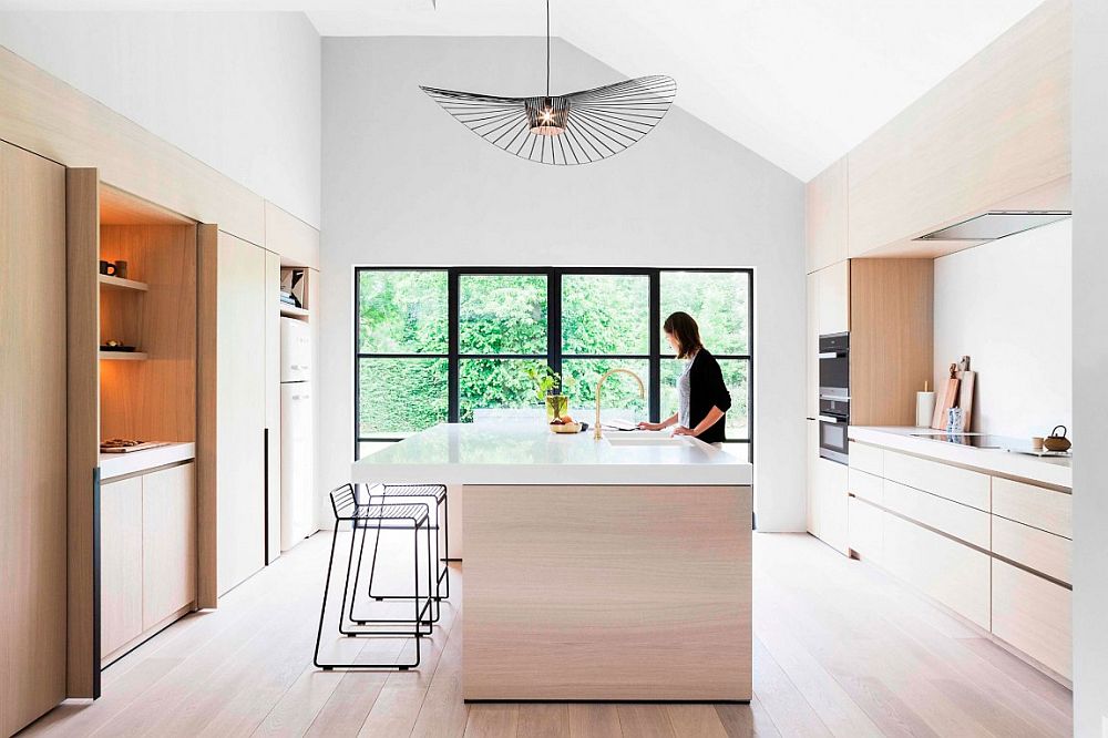 Large Vertigo lamp shines above the smart, modern kitchen island