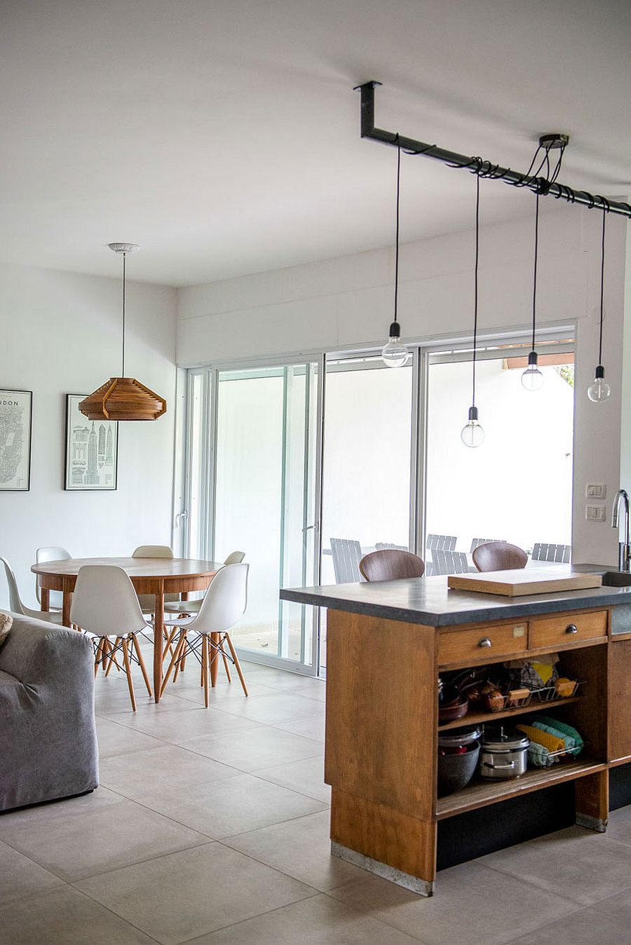 Large glass doors connect the small balcony with the interior