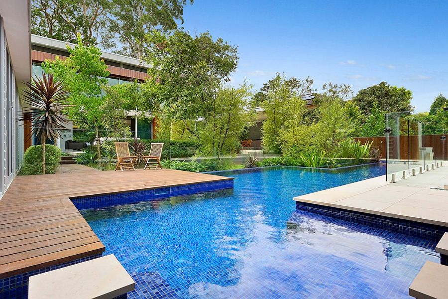 Large pool defines and becomes the focal point of the large yard