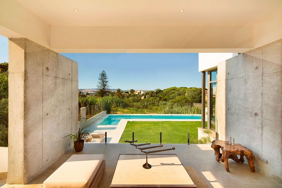 Lavish Spanish home overlooking the backyard, pool area and distant hills