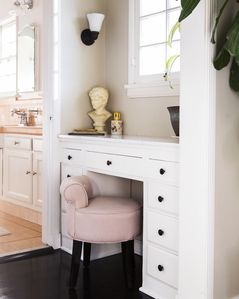 Light pink stool in a traditional bathroom