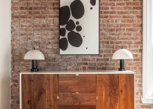 Lovely-modern-wooden-buffet-in-the-living-and-dining-space-with-brick-walls-217x155