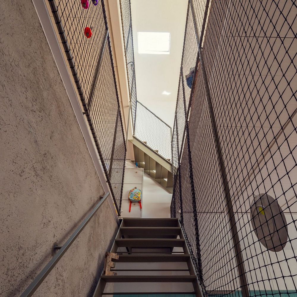 Metallic mesh for the staircase offers a cost effective safety solution for family with kids