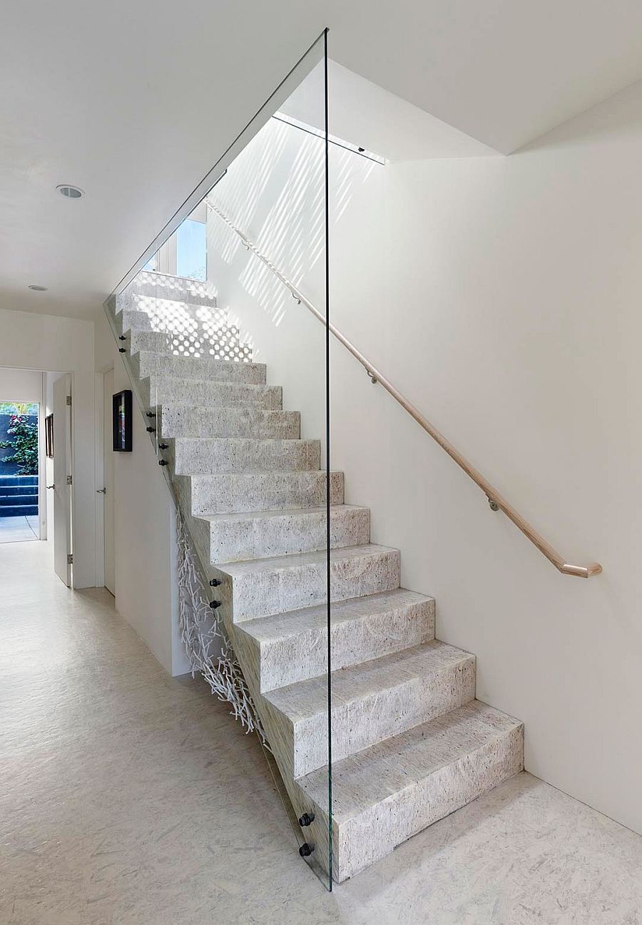 Minimal modern staircase connects teh various levels of revamped San Francisco home