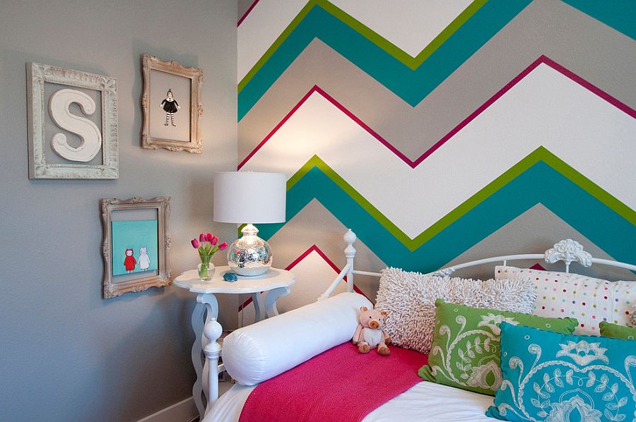 Multi-colored chevron stripes make a stunning accent wall in the kids' bedroom [Design: Judith Balis Interiors / Allison Corona Photography]