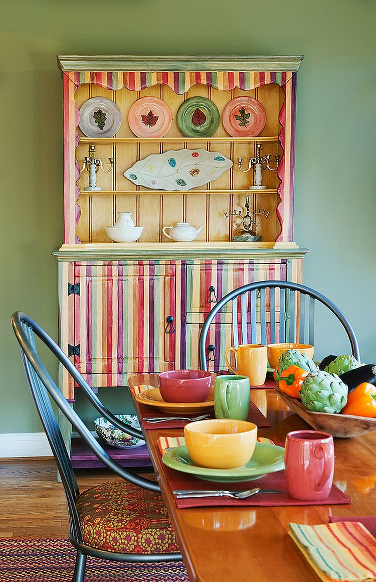 Multi-colored dining room hutch becomes a vivacious focal point in the dining room [Design: Carol Freedman Design]