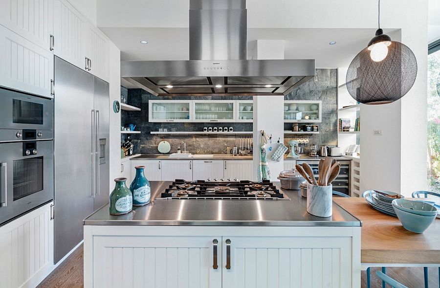 Open kitchen in white and gray with stainless steel and wooden worktops