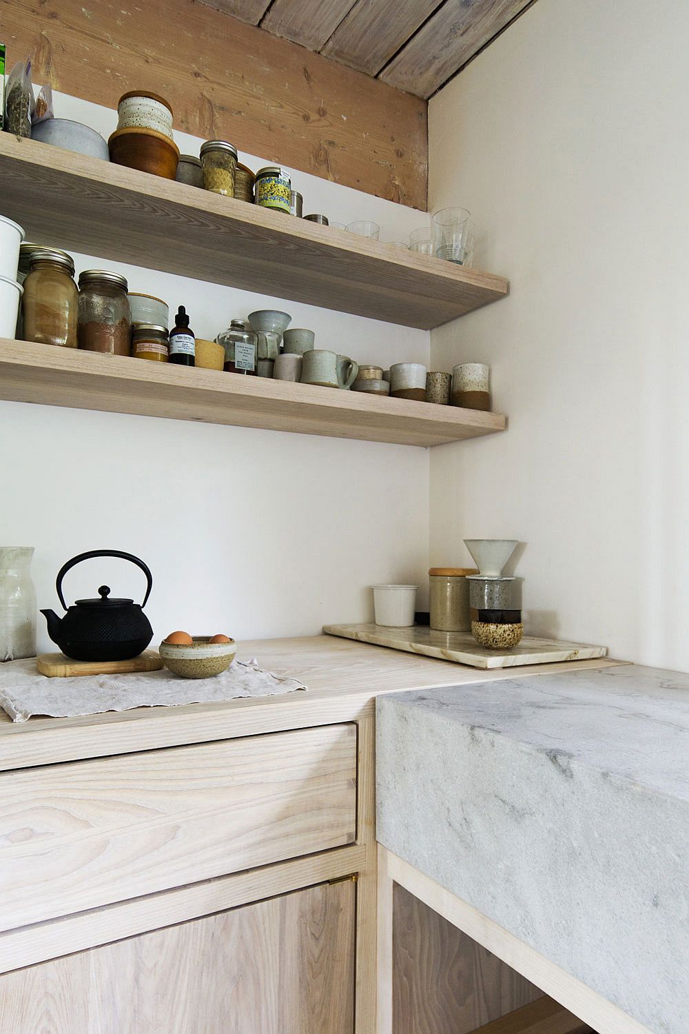 Open kitchen shelves make complete use of vertical space on offer