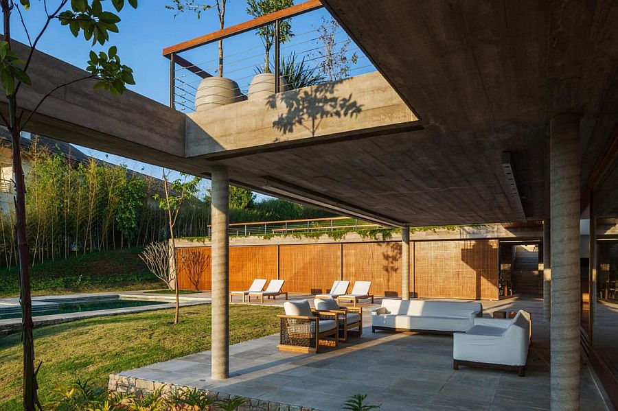 Outdoor sitting zone and poolside deck of the FT Residence