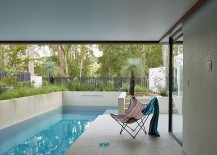 Relaxing-poolside-area-of-the-Bardon-home-with-a-simple-deck-217x155