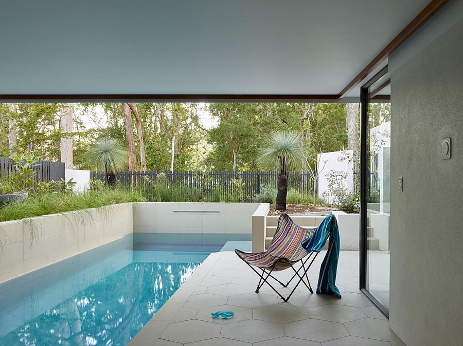 Relaxing poolside area of the Bardon home with a simple deck