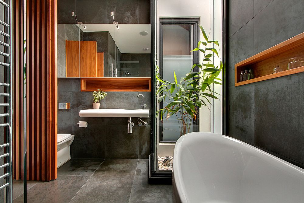 Restrained use of wooden elements brings cozy elegance to the concrete bathroom [Design: LSA Architects]