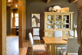 Rustic dining room with a fabulous china hutch that complements its style perfectly