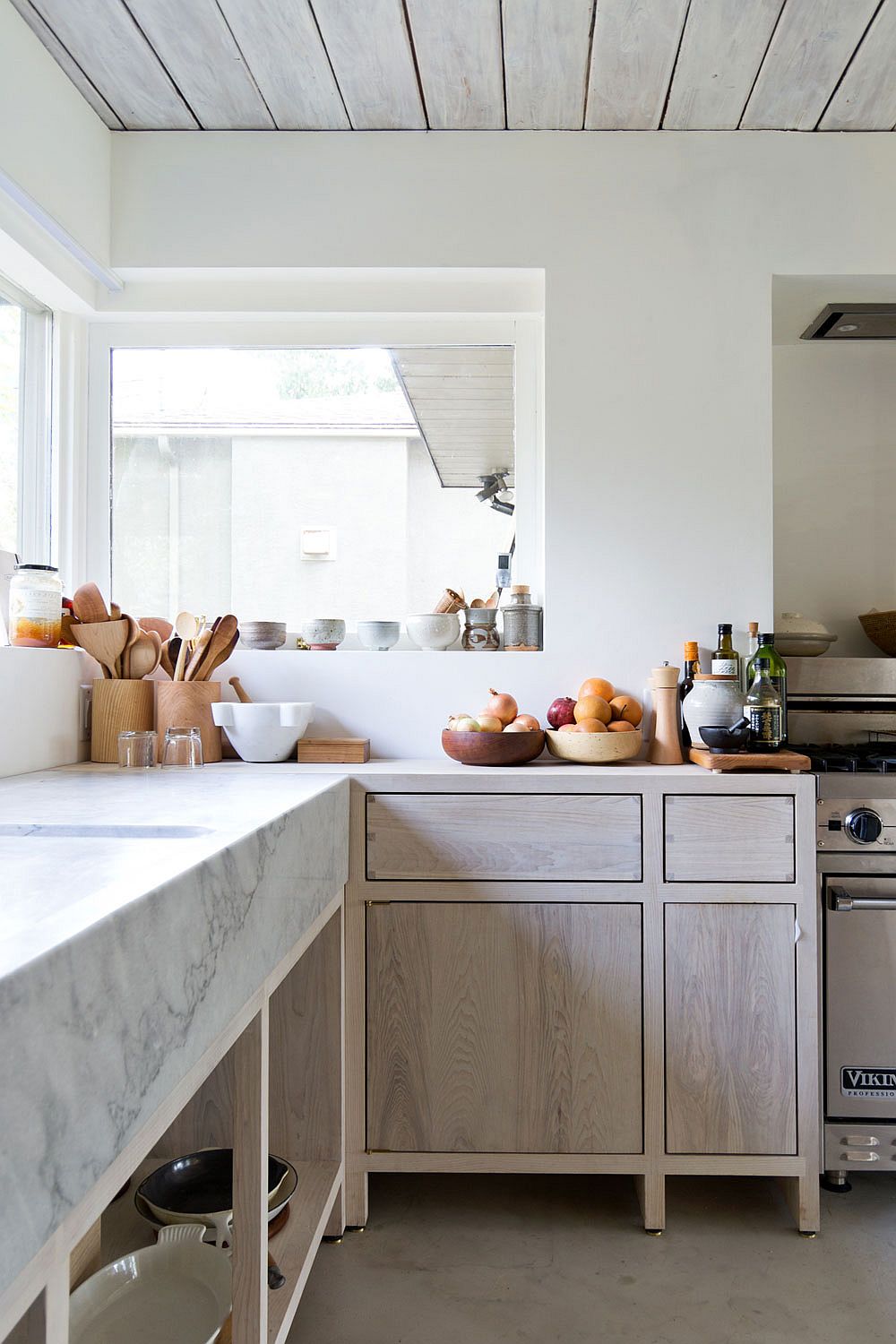 Rustic-minimal-kitchen-design-with-marble-workstation-and-wooden-cabinetry.jpg