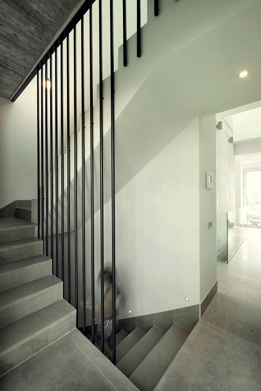 Simple staircase connects the various levels of the home in Algeciras, Spain