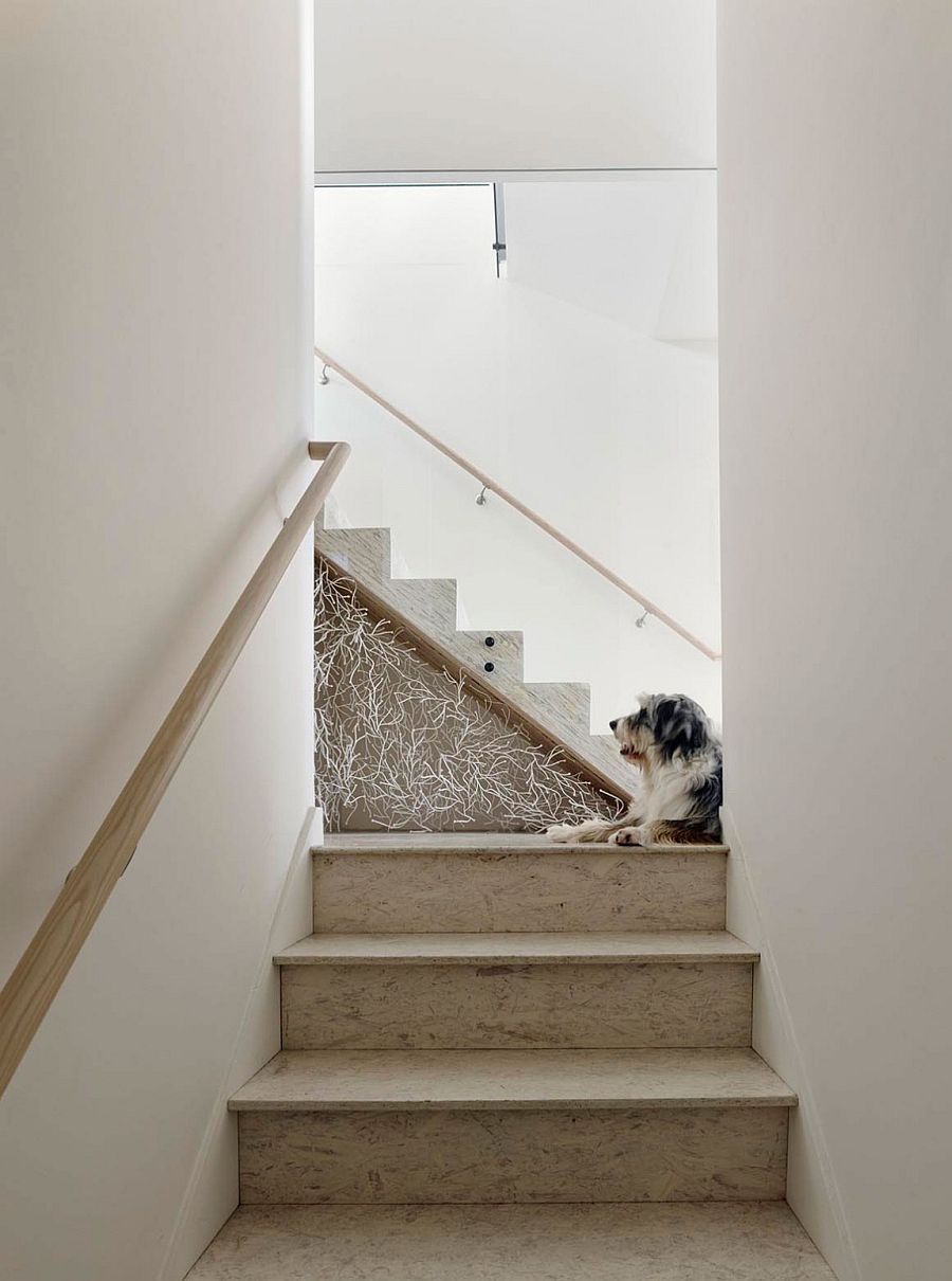 Simple staircase design draped in minimal hues and stone steps