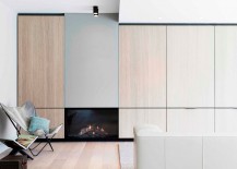 Sleek-cabinets-with-wooden-doors-and-a-minimal-fireplace-give-the-living-space-a-sophisticated-appeal-217x155
