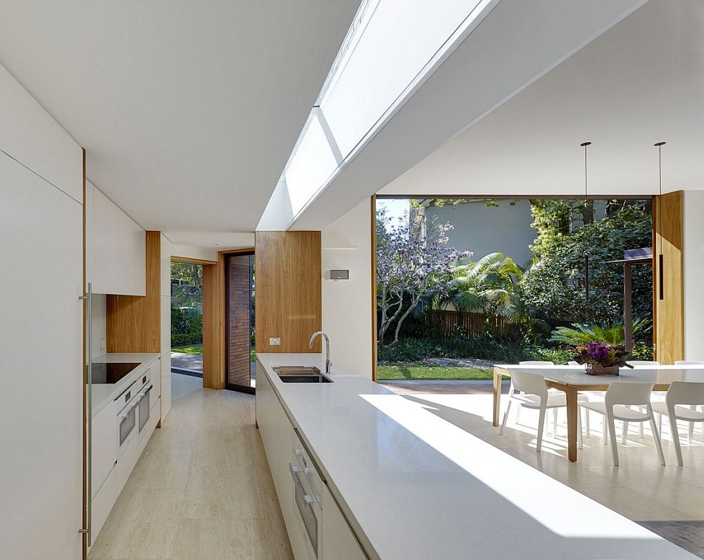 Sleek design of the contemporary kitchen maximizes open space indoors