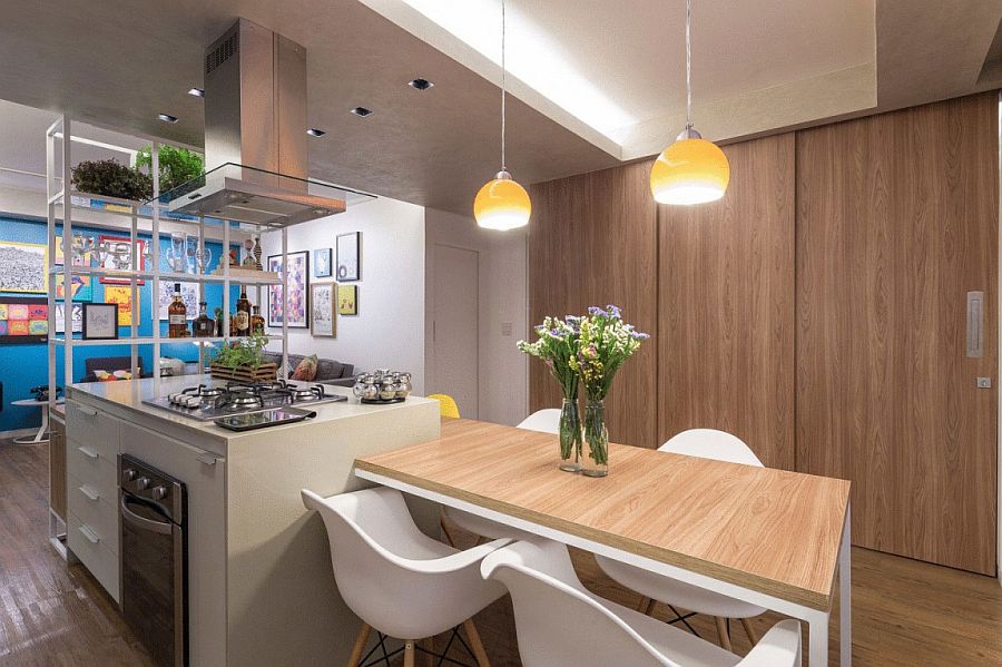 Sliding doors in the dining area conceal the home office