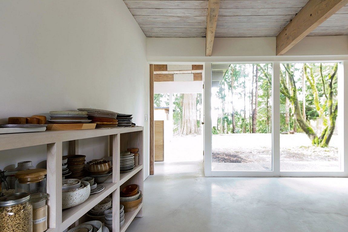 Sliding glass doors connect the kitchen and living area with the outdoors