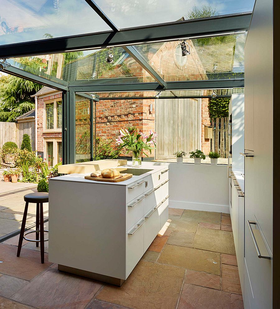 Sliding glass doors open up the kitchen to the garden