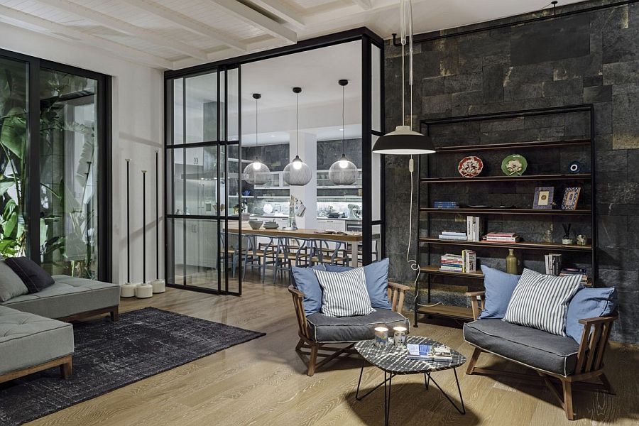 Sliding glass walls delineate the living area from the dining room