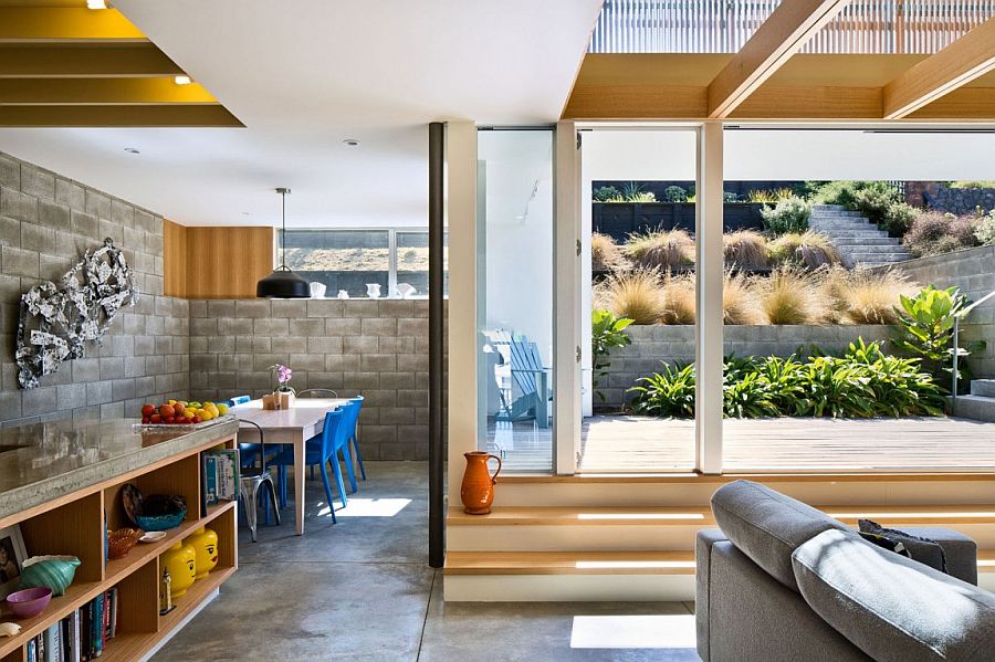 Smart dining space and living area connected with the sunny rear courtyard