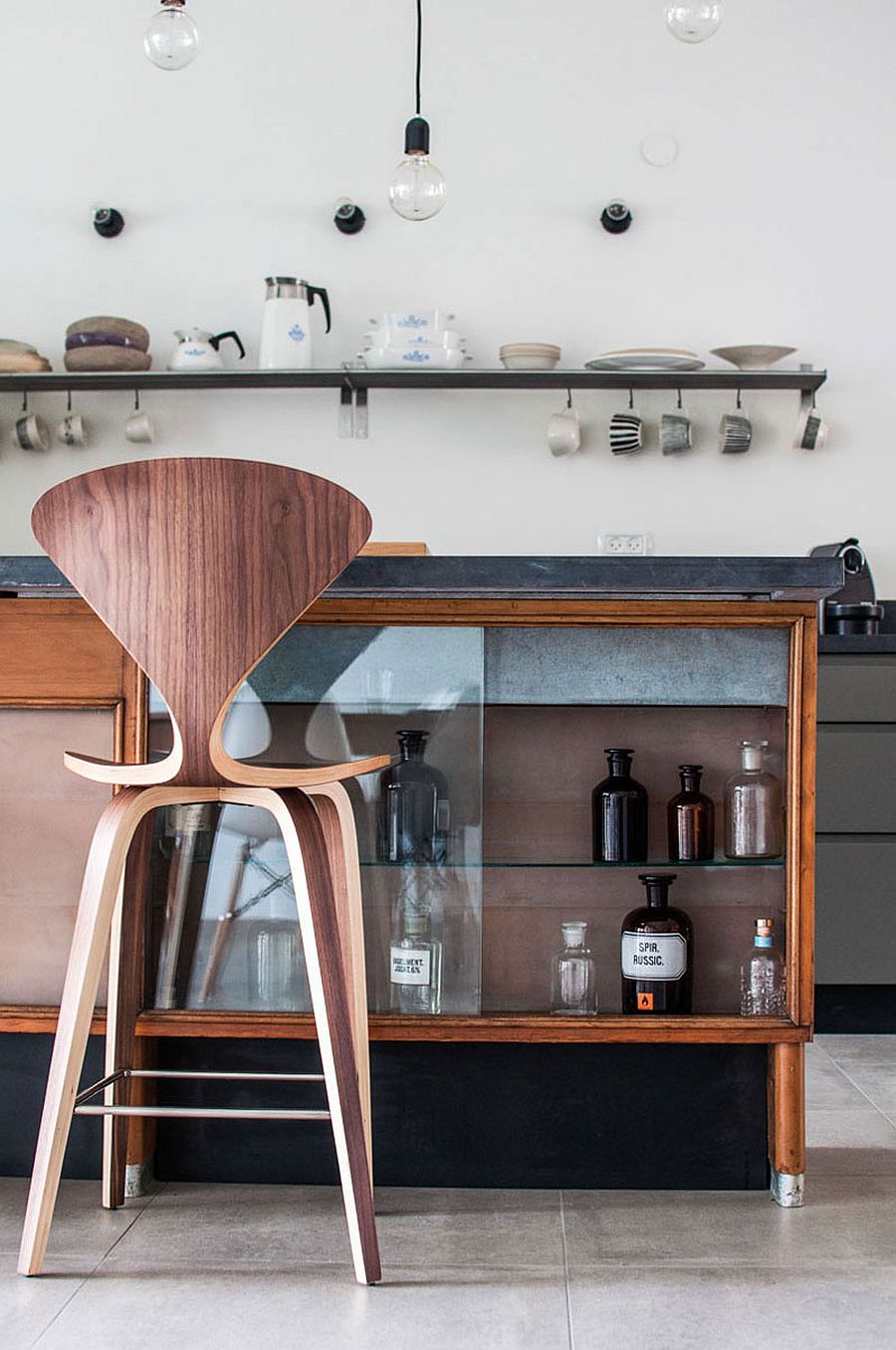 Smart shelves in the kitchen and trendy island offer plenty of storage