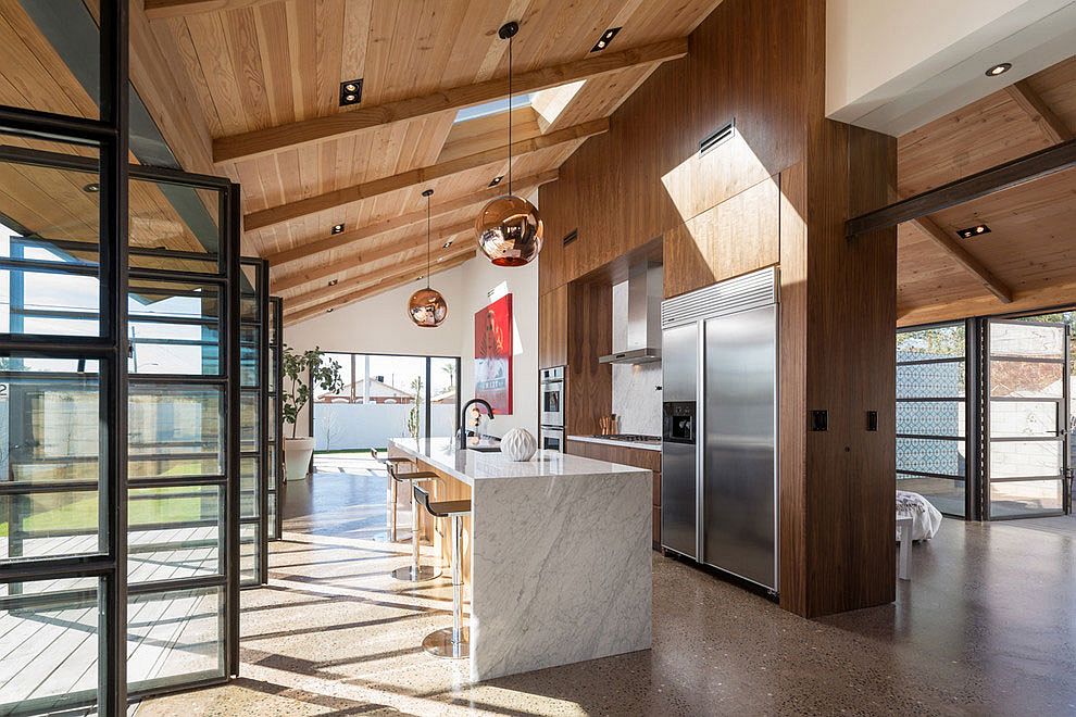 Snazzy walnut and marble kitchen added to the existing Carriage House