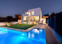 Spacious-backyard-and-L-shaped-pool-of-luxury-Spanish-residence-217x155