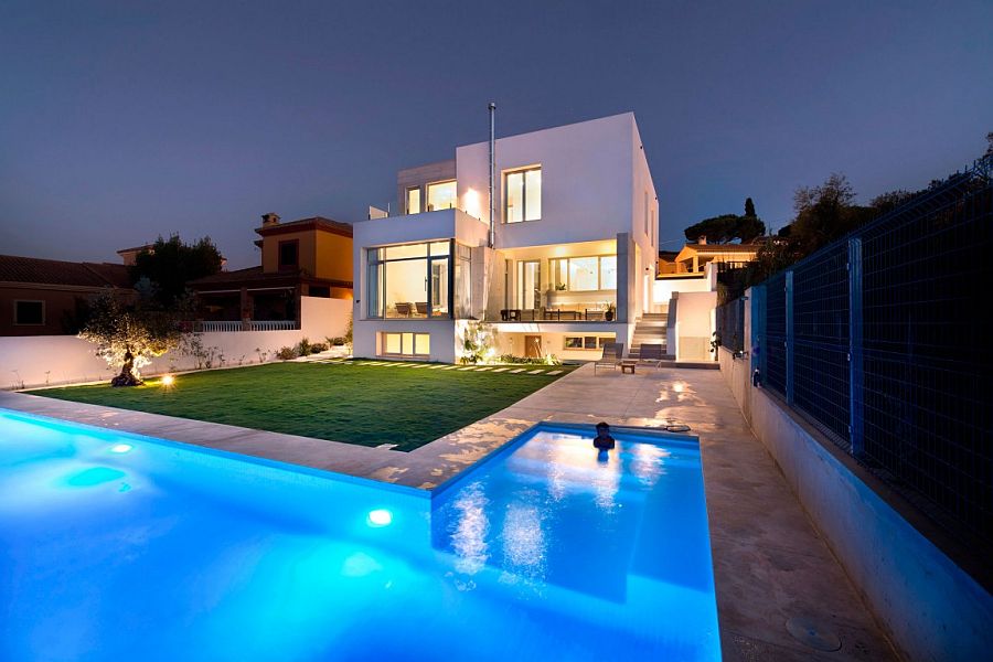 Spacious backyard and L shaped pool of luxury Spanish residence