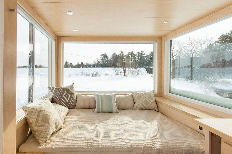 Spacious bed inside the 160 sqaure foot tiny home on wheels