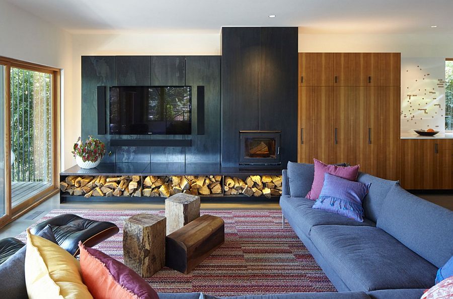 Stacked firewood adds textural contrast to the contemporary interior