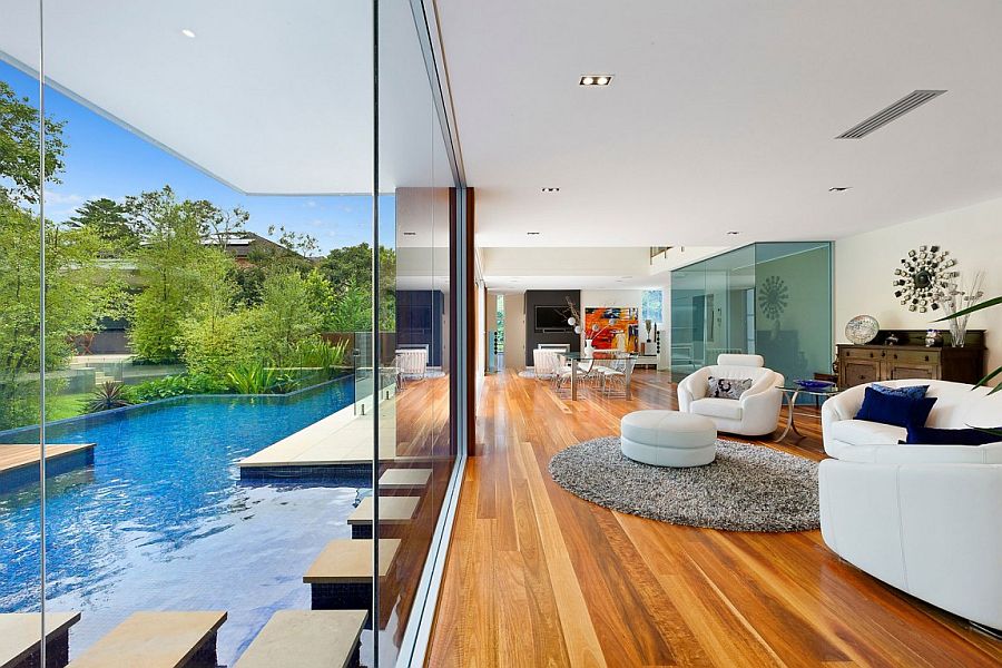 Stunning living area of the Sydney home becomes one with the pool outside