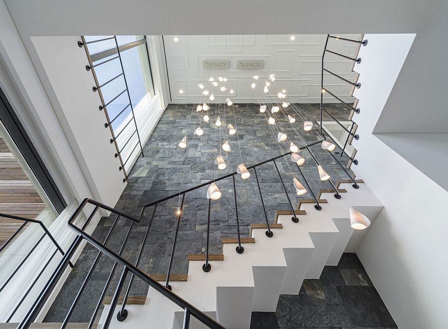 Stunning use of cascading chandelier at the staircase