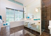 Super-sleek-contemporary-bathroom-with-a-white-bathtub-abd-acrylic-chair-217x155