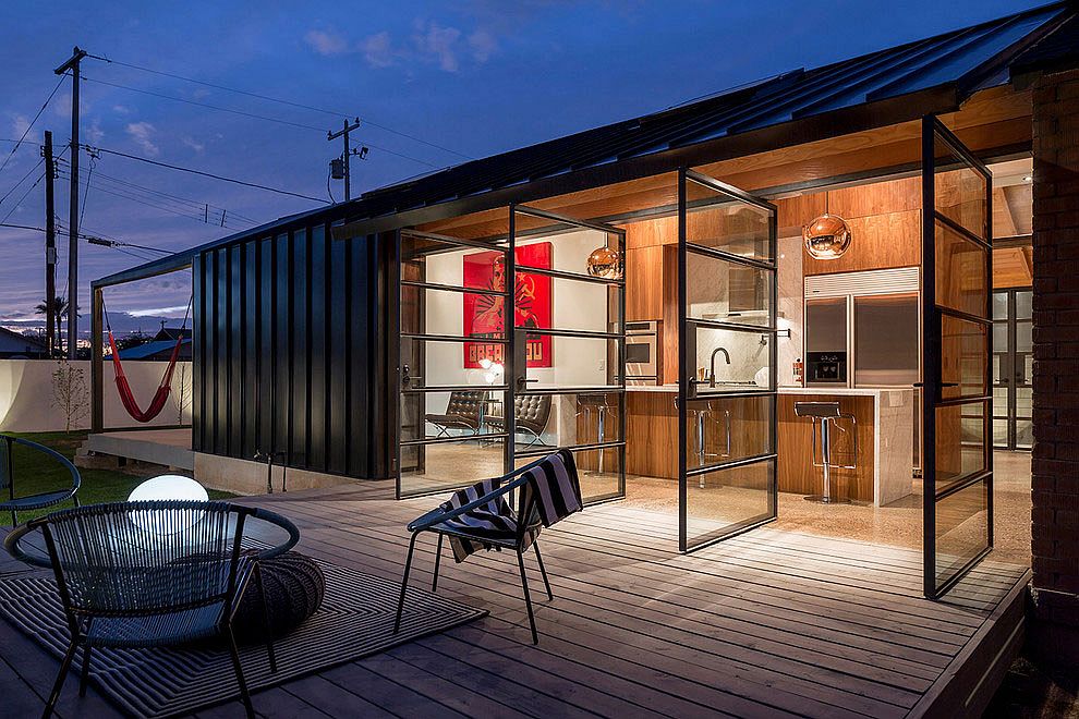 Swiveled glass doors connect the interior with the small deck