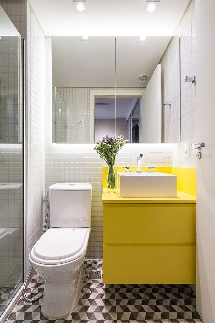 Tiny vanity in bright yellow for the small bathroom in white