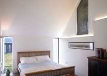Two-glass-windows-next-to-the-bed-usher-in-ample-natural-light-217x155