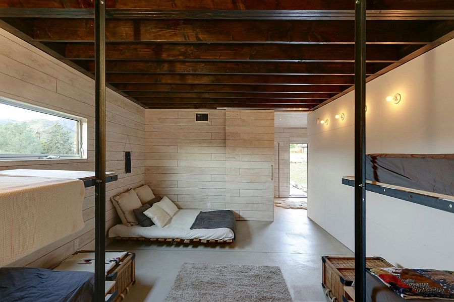 Unique design of beds and use of recycled materials adds to the appeal of stylish cabin